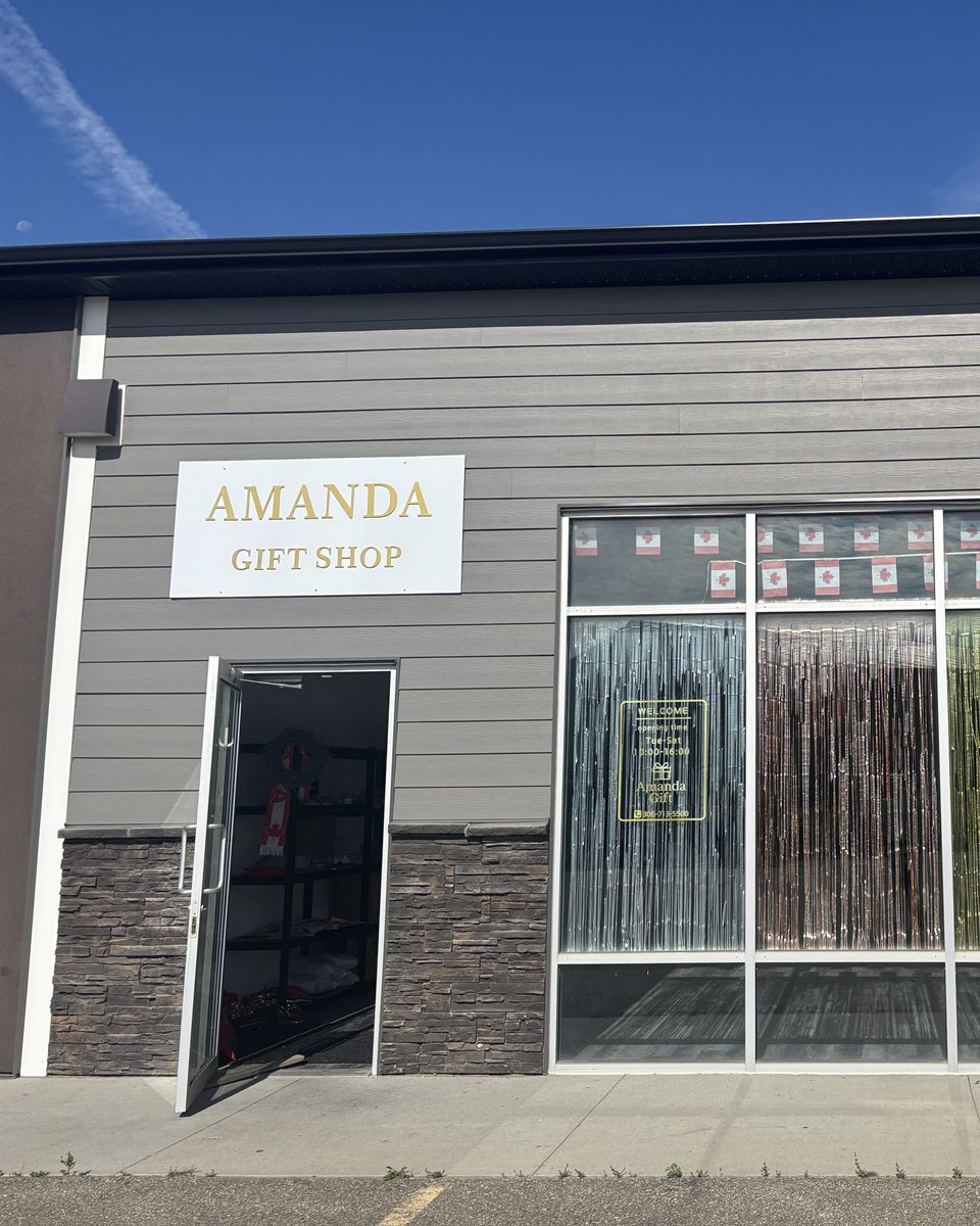 The Amanda Gift Shop storefront, sign and open door